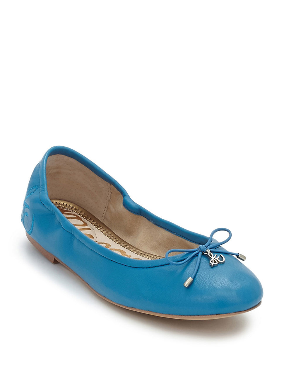 flat shoes with turquoise soles