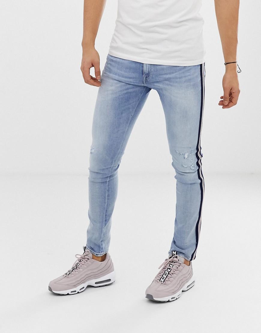 side stripe ripped jeans