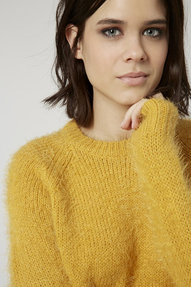fluffy yellow sweater