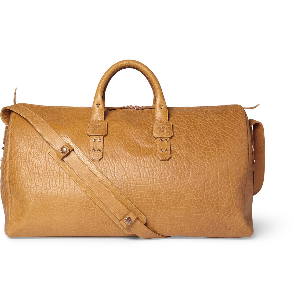 brown leather holdall bag