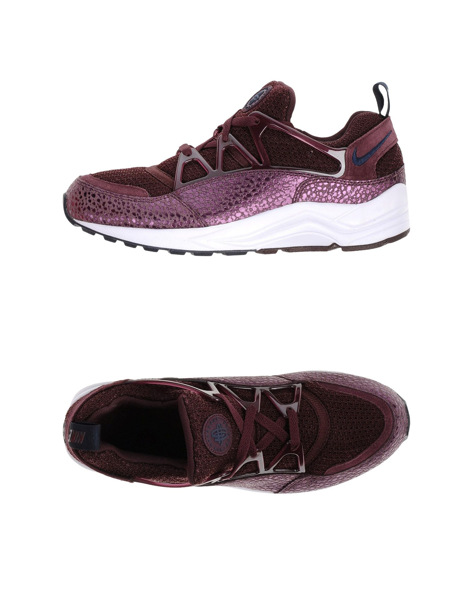 black and purple nike trainers