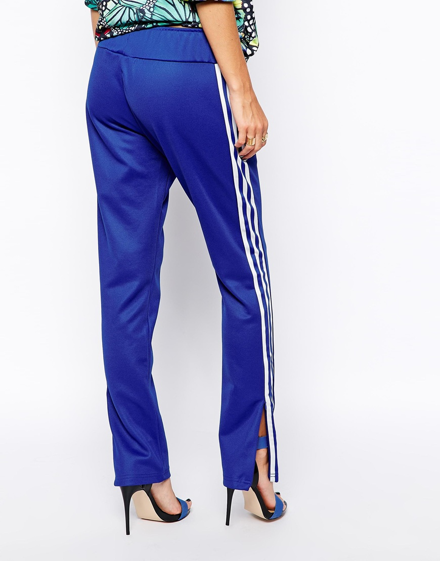 blue sweatpants with white stripe