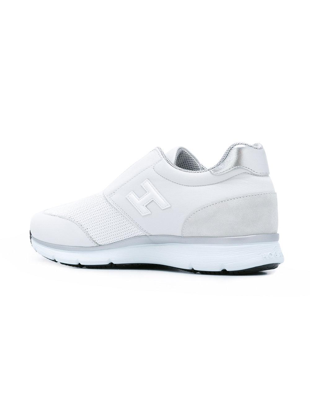 white laceless canvas shoes