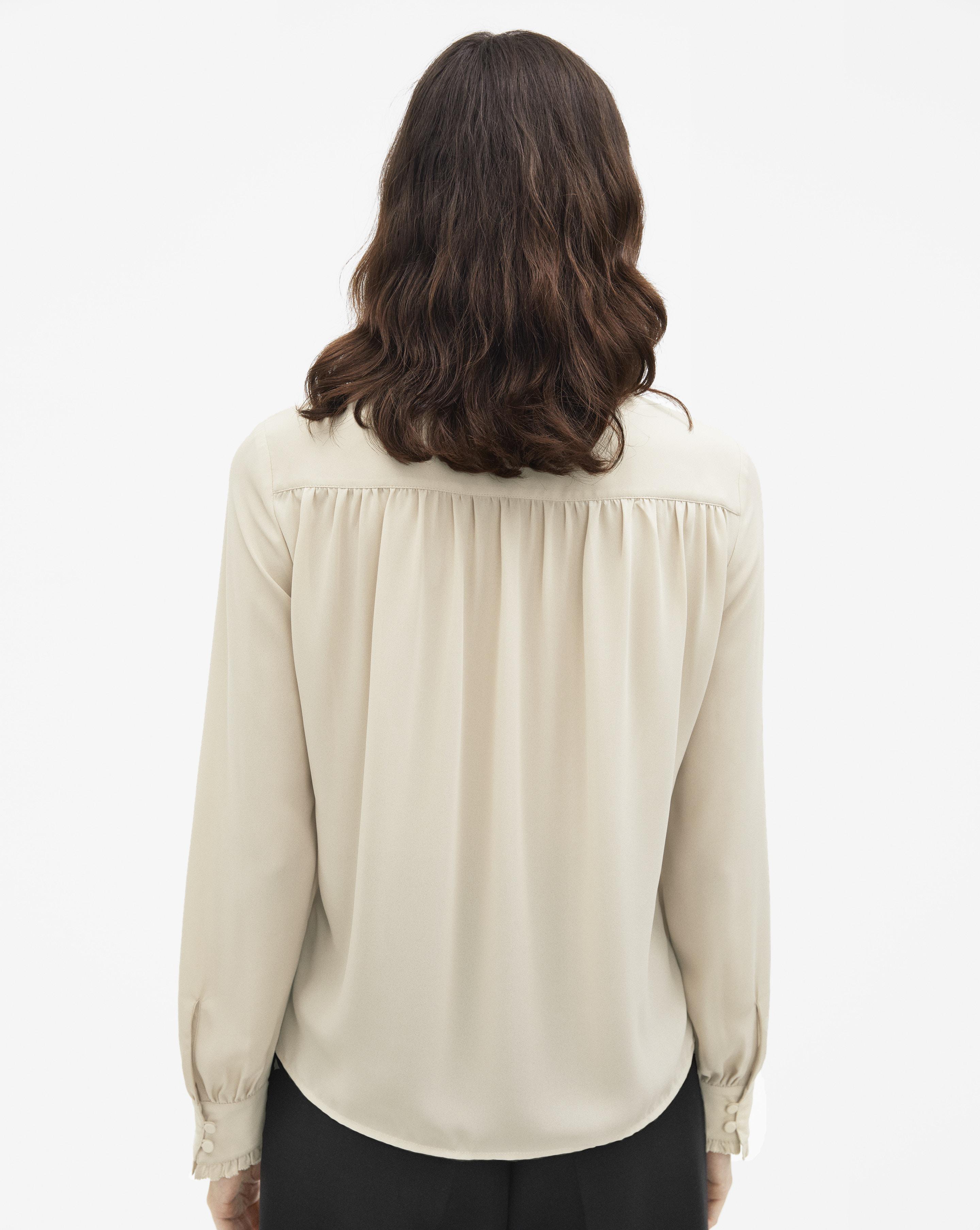 sheer cream blouse