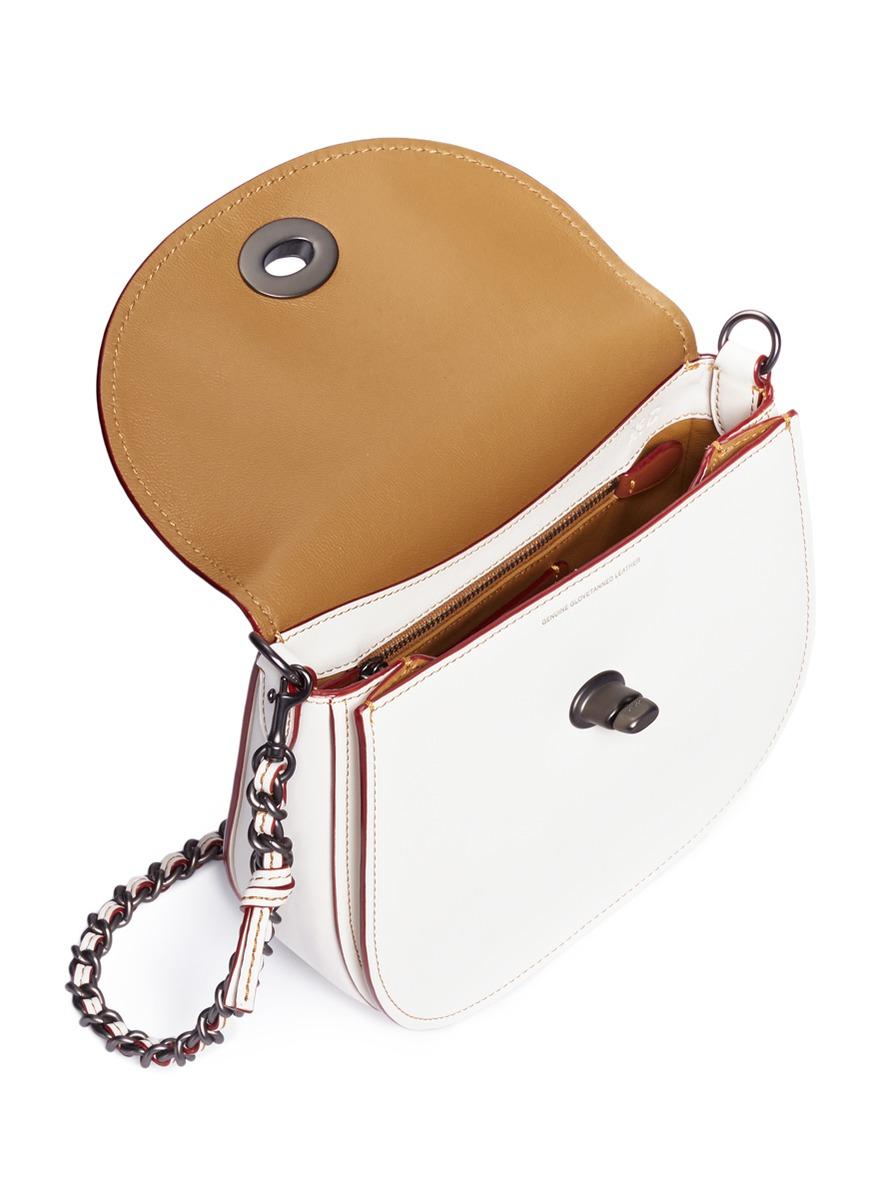 coach turnlock clutch white