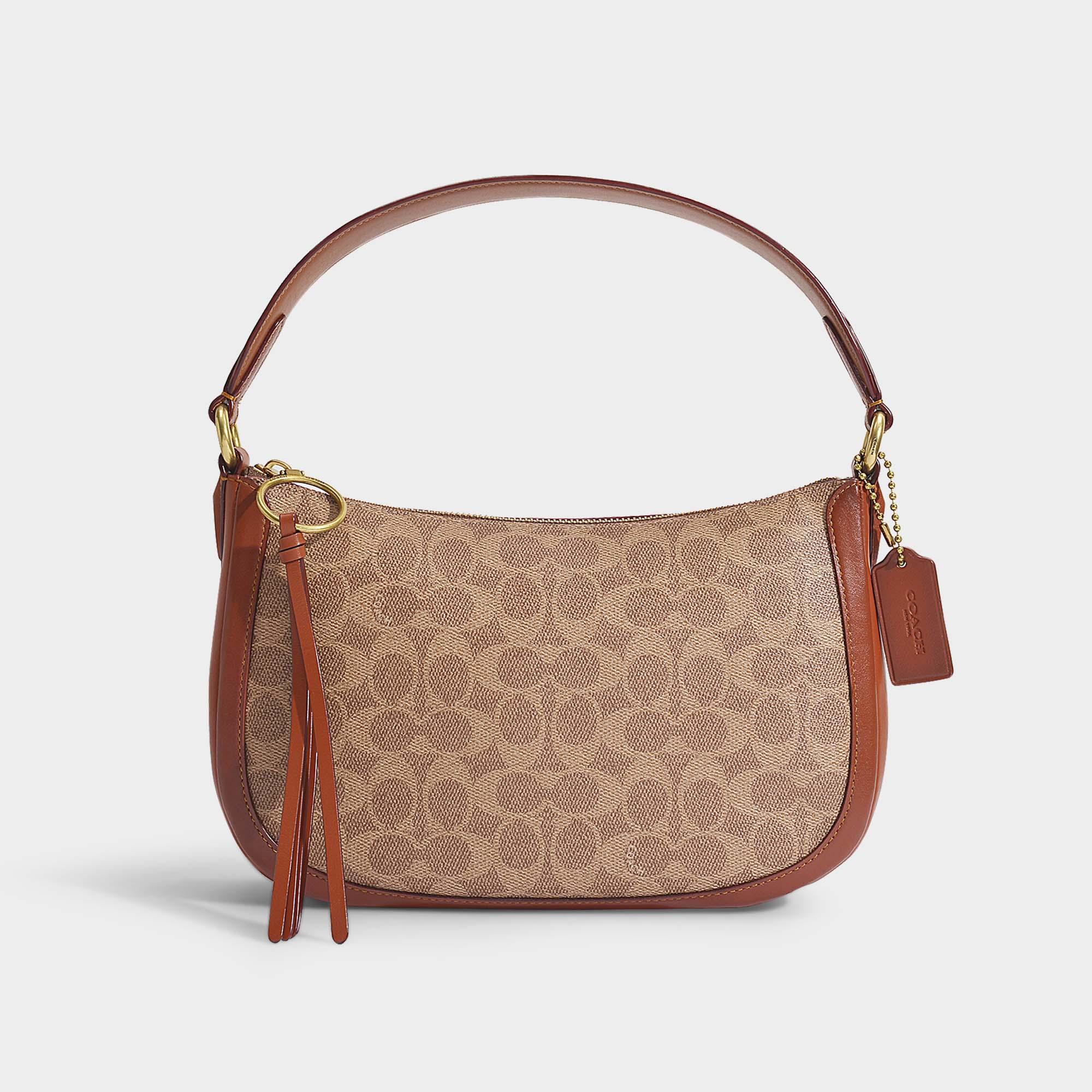 COACH Signature Coated Canvas Sutton Crossbody Bag In Brown Pvc in Brown - Lyst