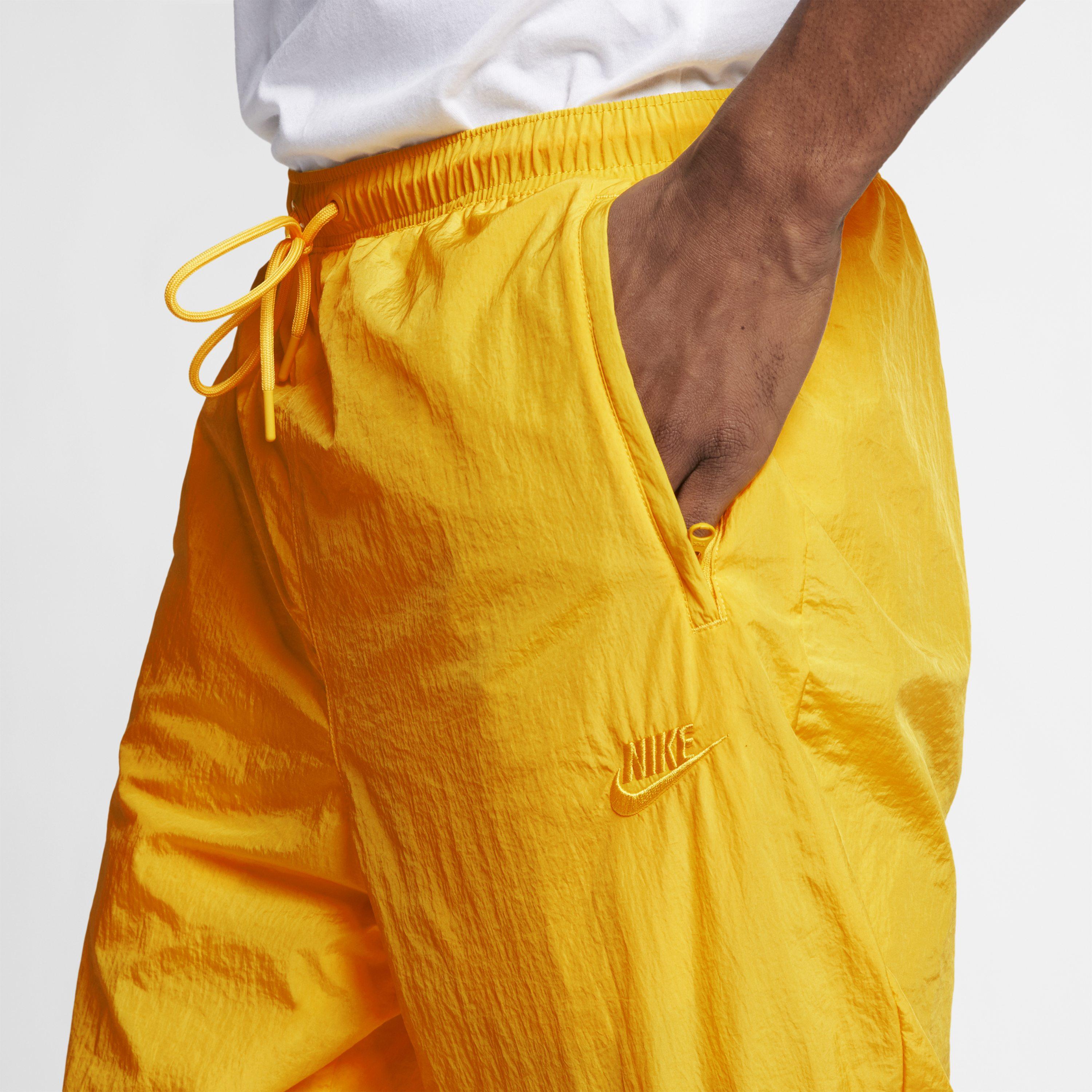 Nike Sportswear Woven Trousers in Yellow Lyst