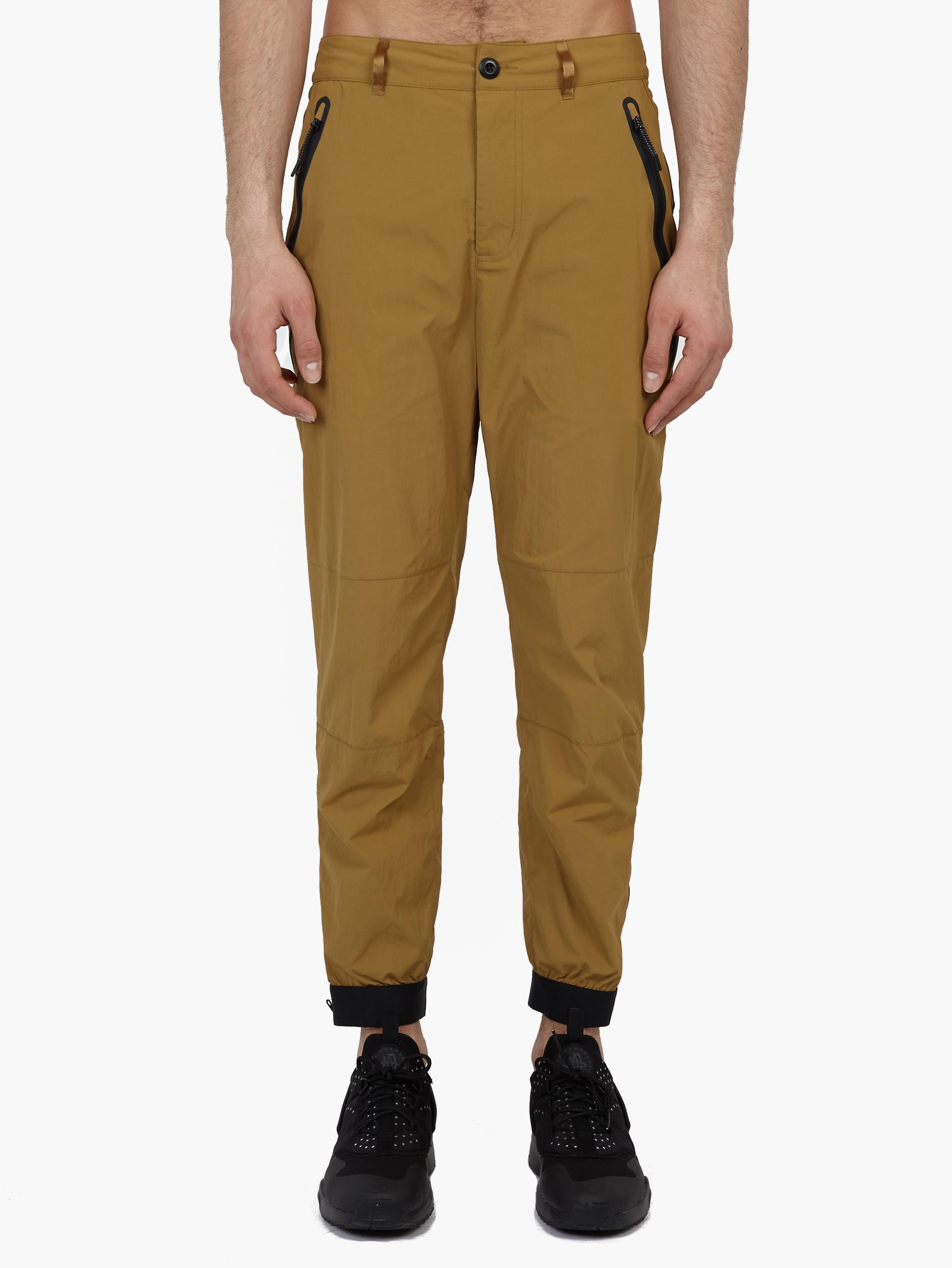 brown nike tech pants