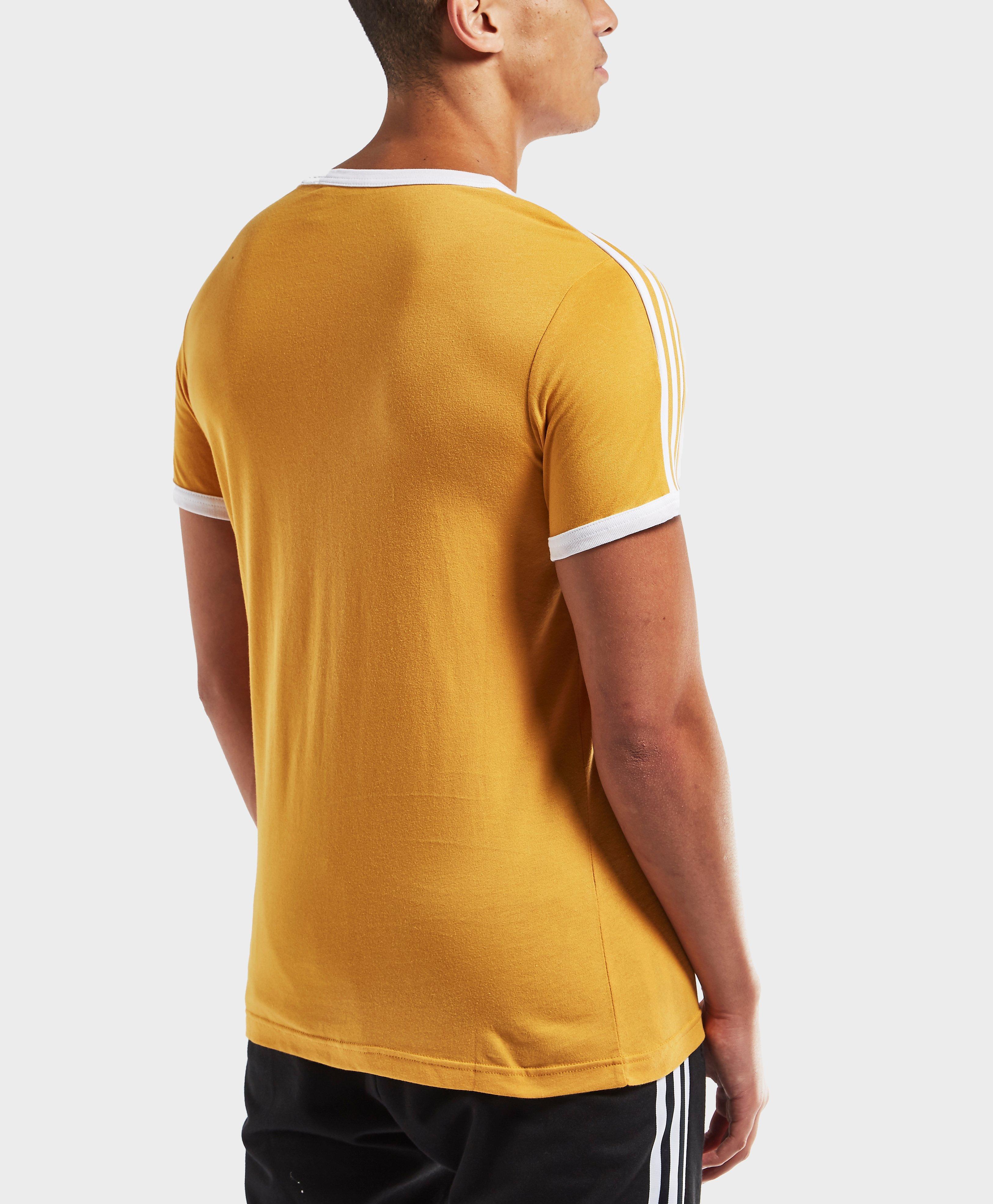 white and yellow adidas shirt