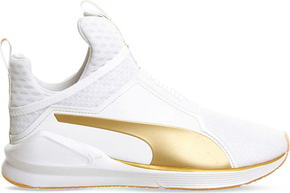 white and gold puma shoes