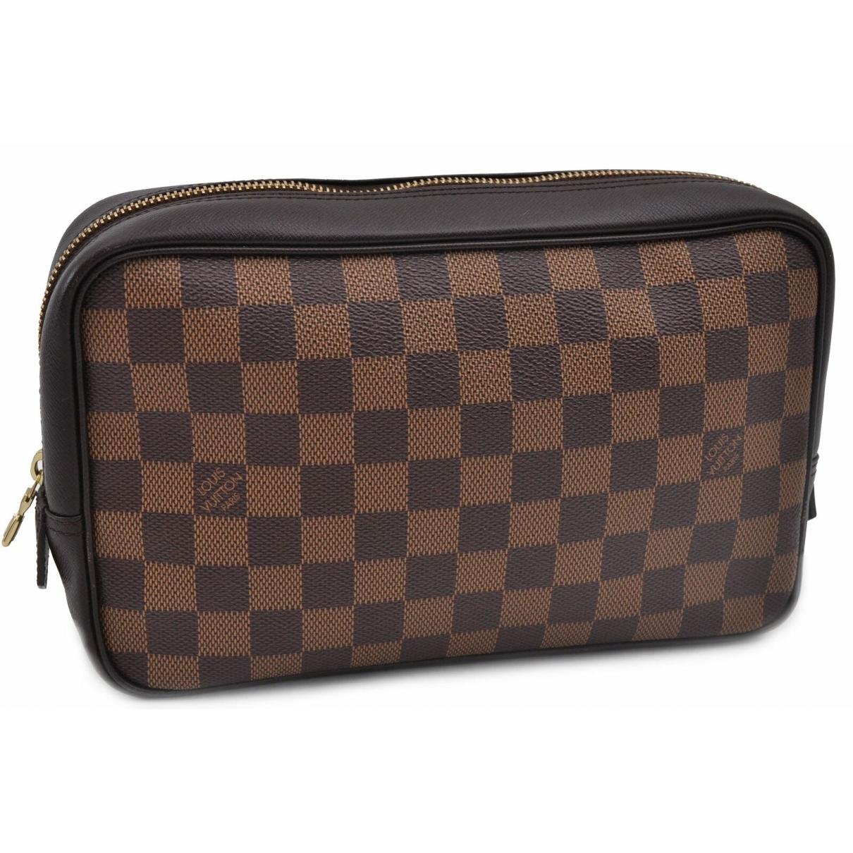 Louis Vuitton Brown Cloth Clutch Bag in Brown - Lyst