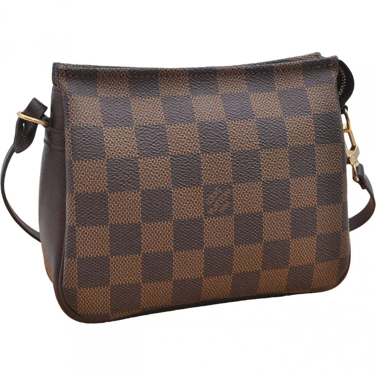Louis Vuitton Cloth Clutch Bag in Brown - Lyst