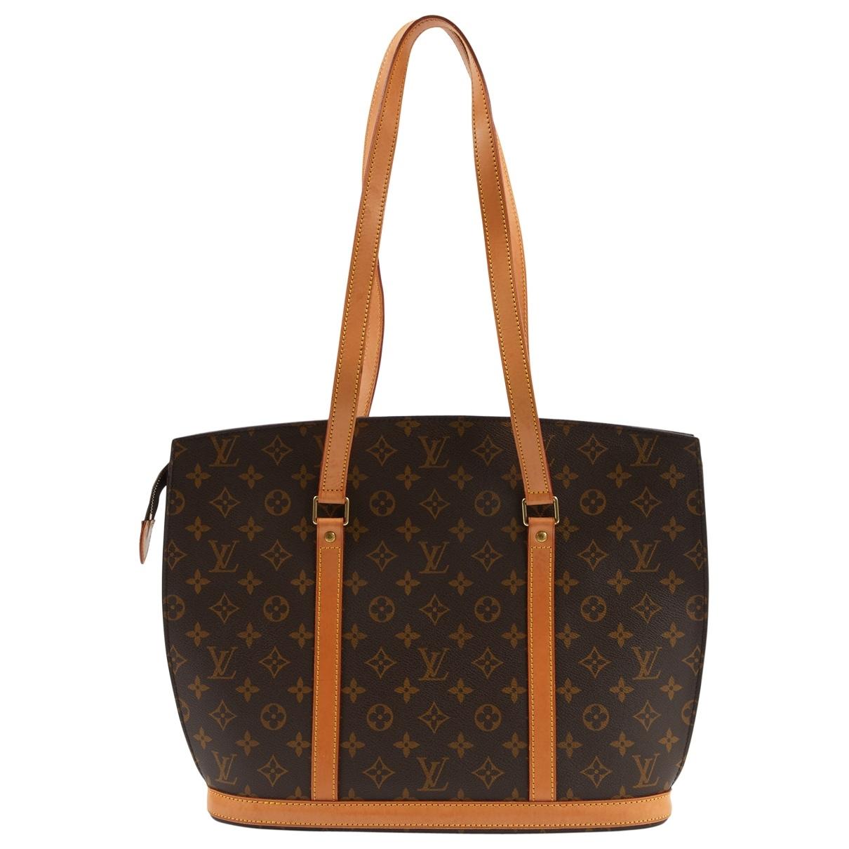 Lyst - Louis Vuitton Babylone Brown Cloth Handbag in Brown
