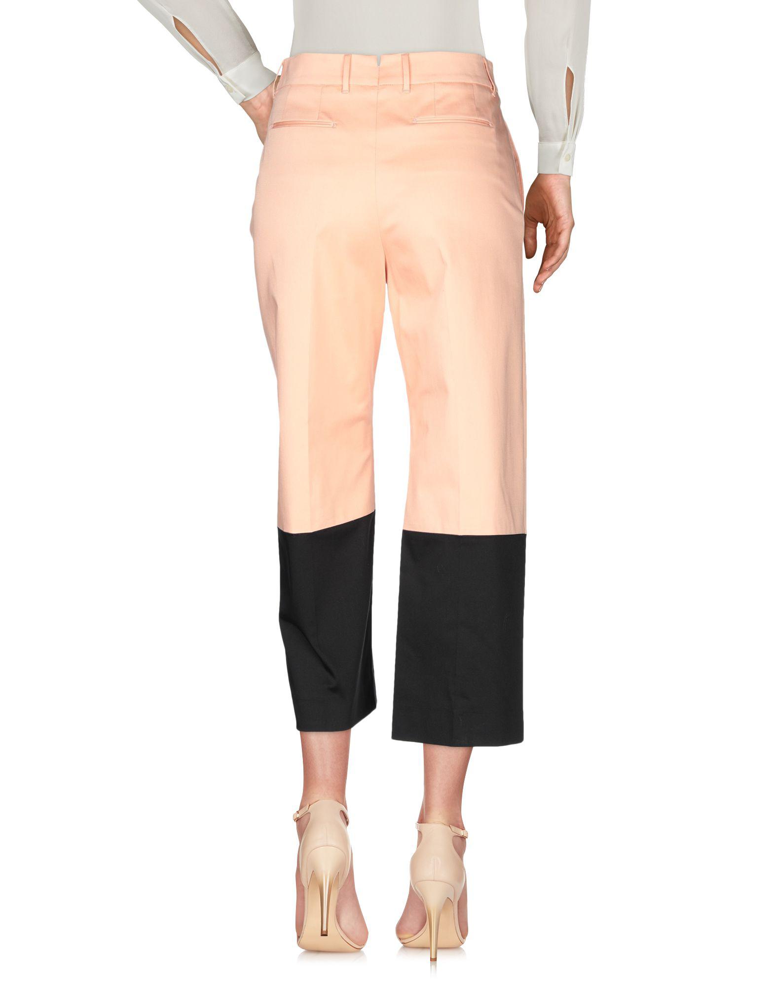 salmon pink trousers